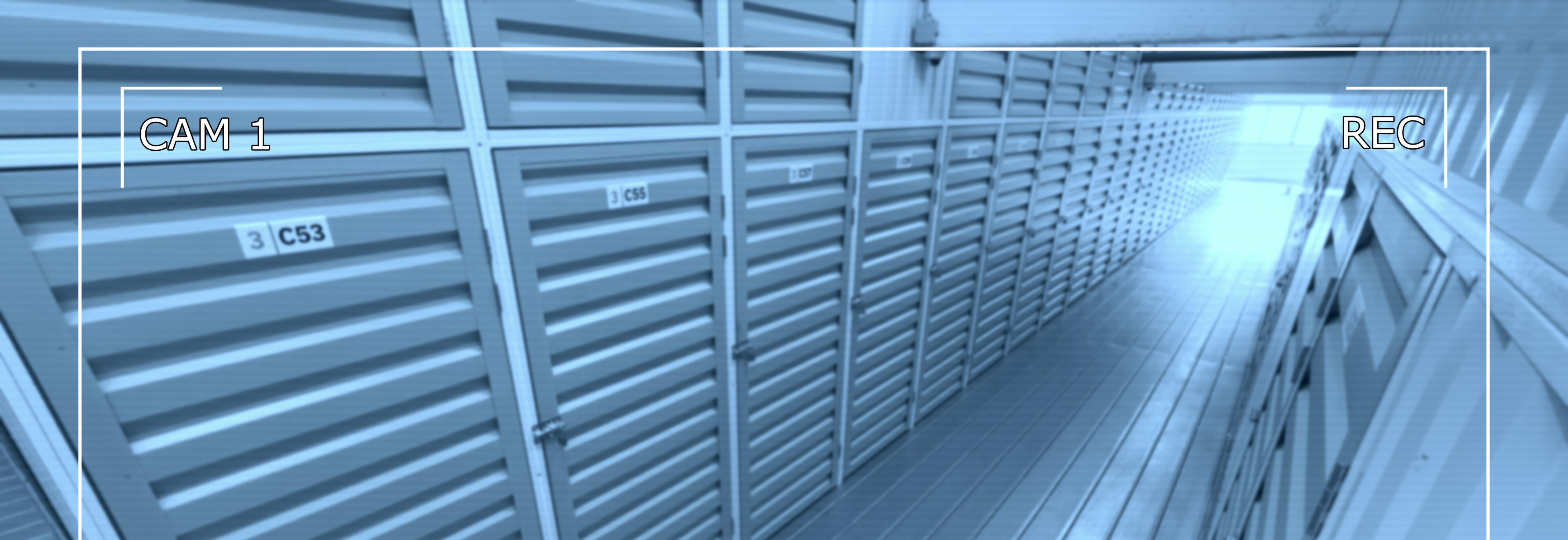 CCTV camera monitoring a modern self storage facility similar to Locked Self Storage Alloa, showing secure corridors and individual storage units.