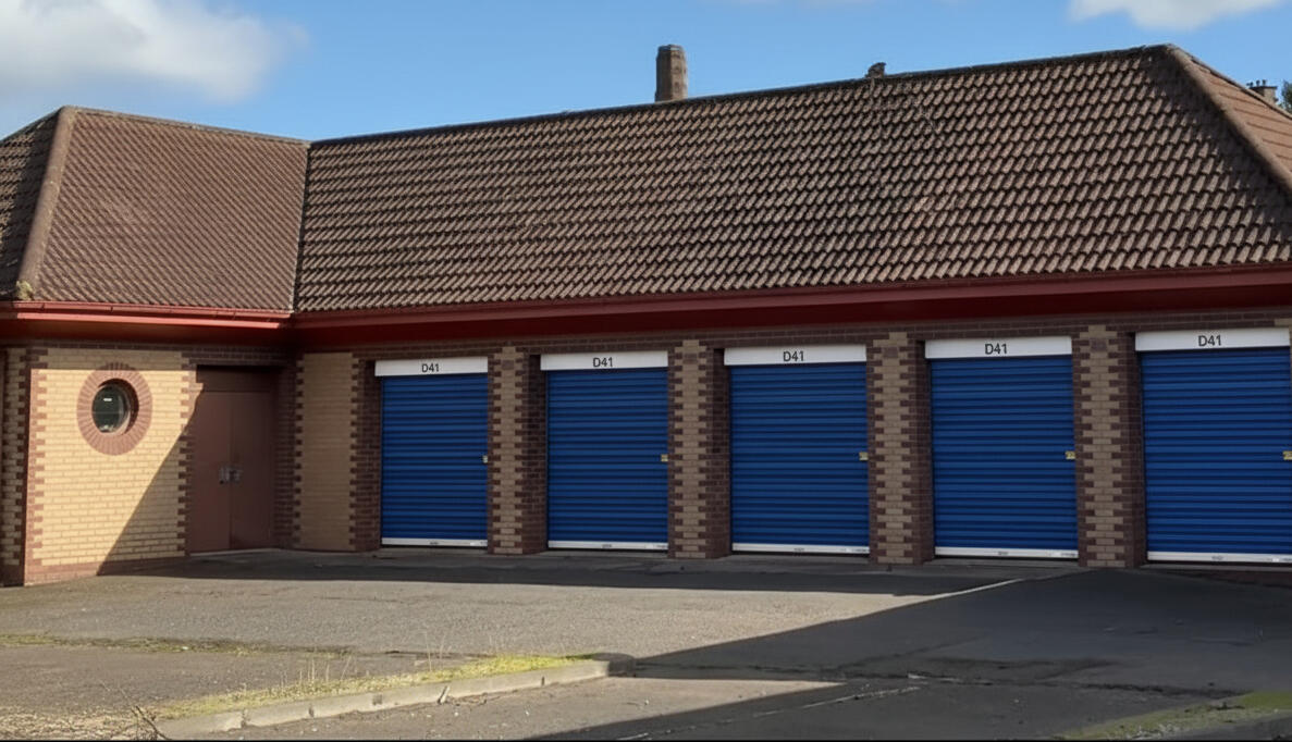 Drive-up Garage Vaults at Locked Self Storage Alloa, featuring reinforced brick walls, power, and lighting for trades and business storage.